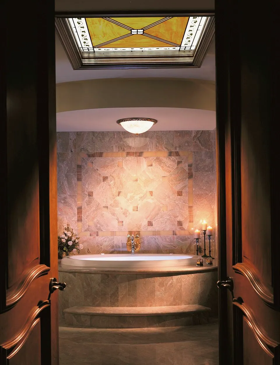 Tub alcove under a stained glass skylight