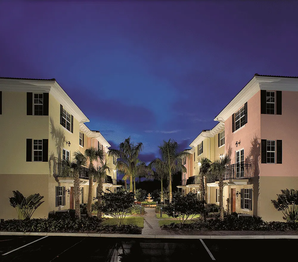 Townhouse courtyard lit at dusk