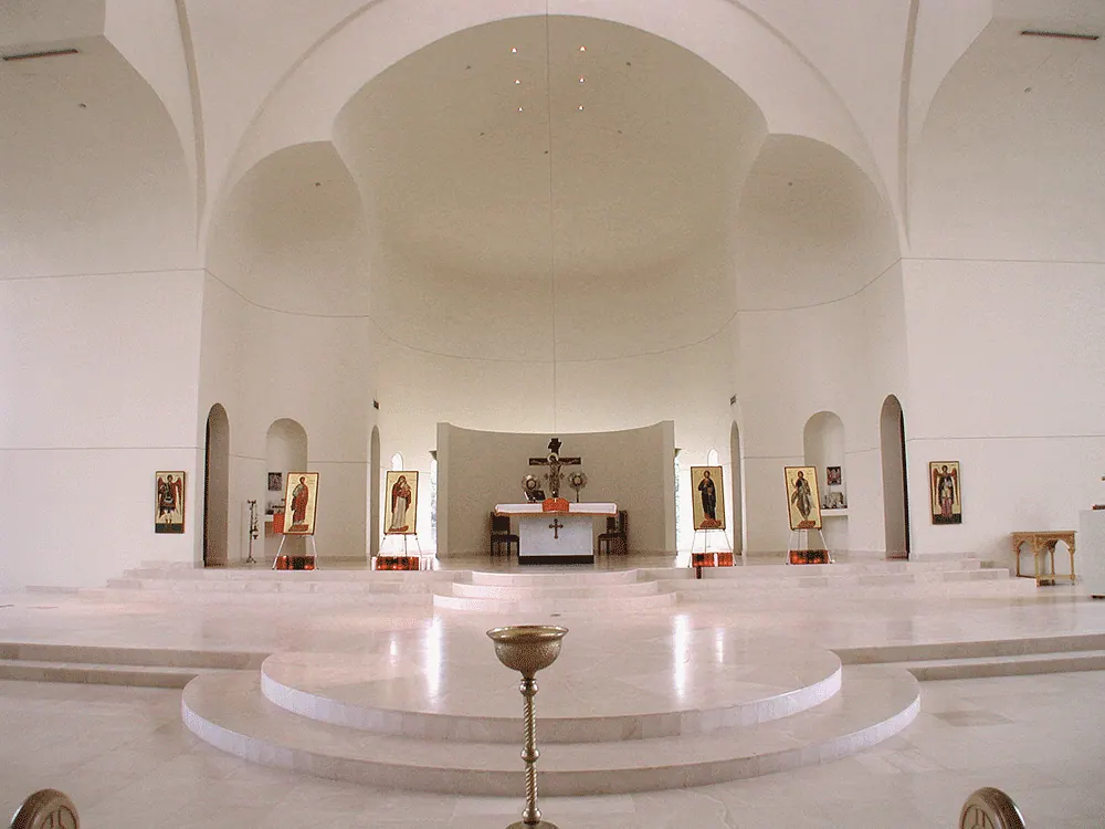 Sanctuary with an arched apse and a marble floor