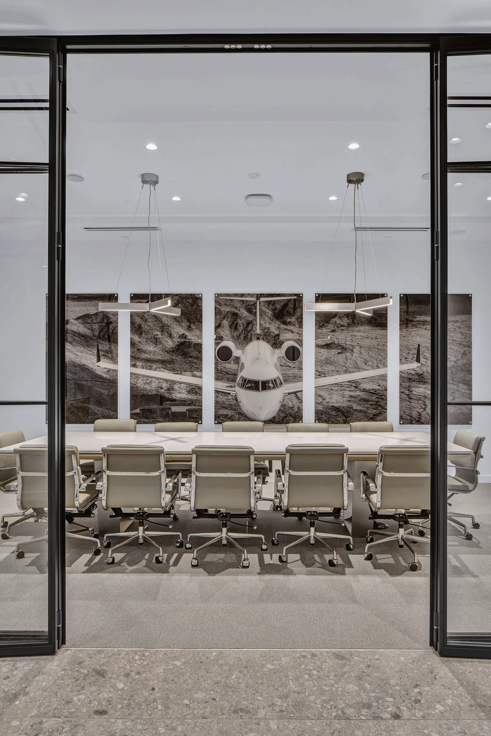 Boardroom seen through steel-framed glass doors