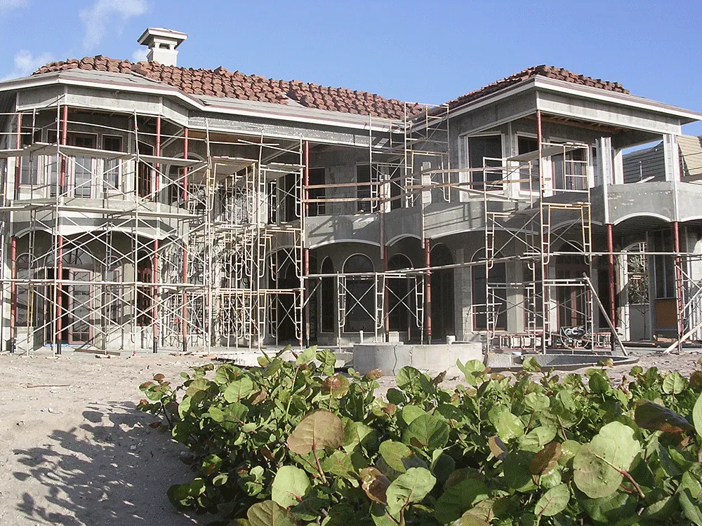 Scaffolding around a house as the roof tile goes on