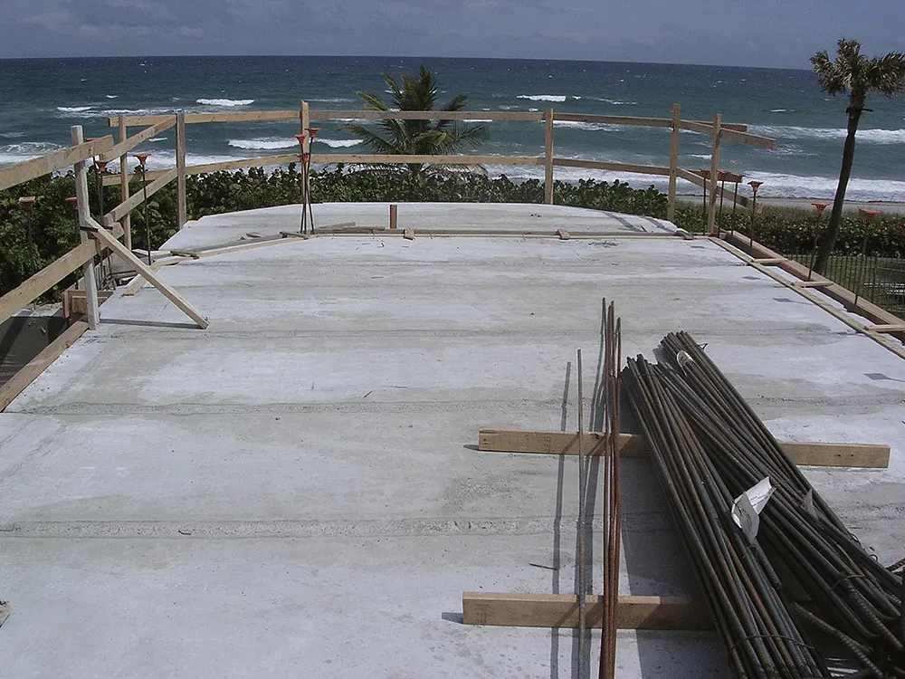 Concrete roof deck with rebar, the ocean beyond