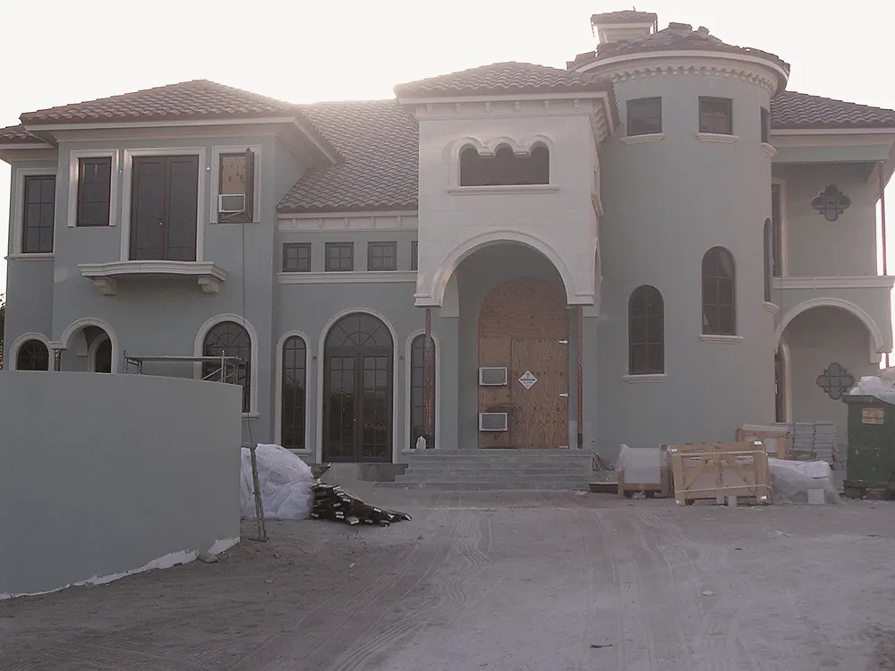 Mediterranean house stuccoed with the tile roof on, before the landscaping
